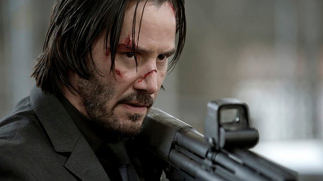 What type of weapon does John Wick prefer?